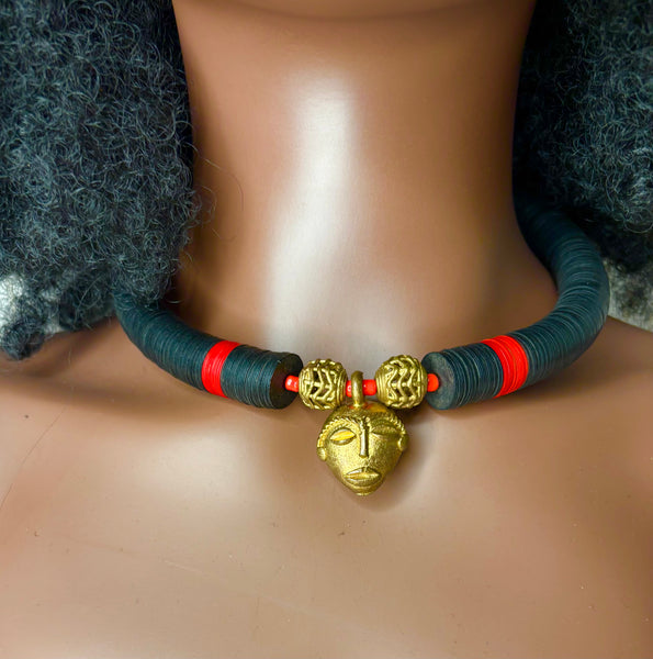 Yuya choker with a bronze mask in black with dashes of red.