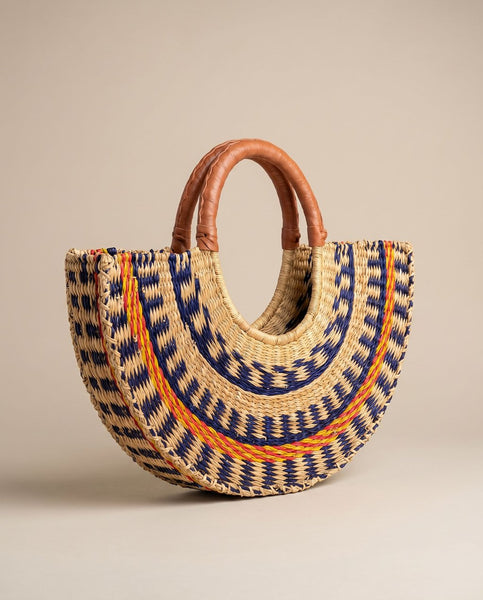 Hand woven sculptured straw half moon bag with leather handles