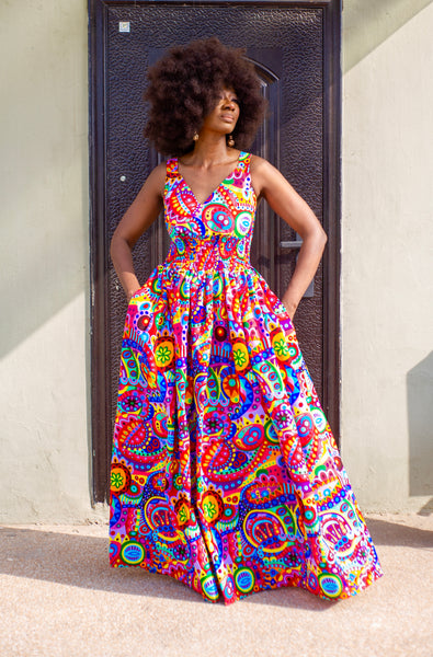 Fatu full skirt dress in multicoloured abstract pattern.