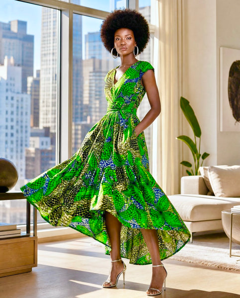 Wuntia dipped hem full belted dress with a deep V neck.