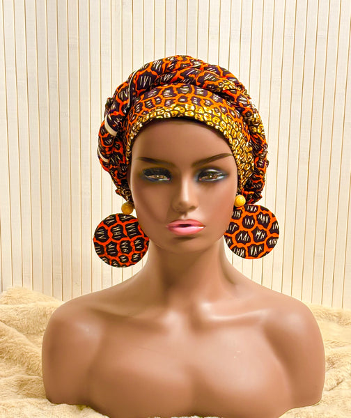 African print head wrap and large disc earrings set in an orange geometric vintage print.