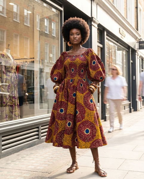 Puff sleeve statement dress in a vintage geometric African print.