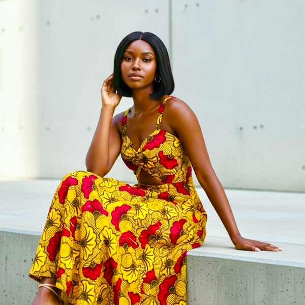 RIBA Maxi cut out sleeveless dress in a vibrant African print floral pattern.