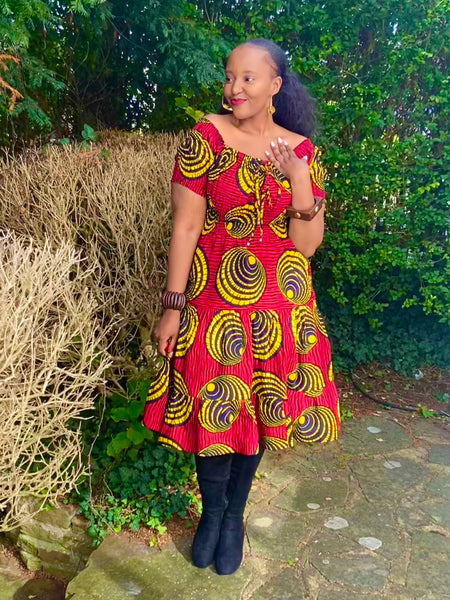 Smocked peasant inspired African print dress.