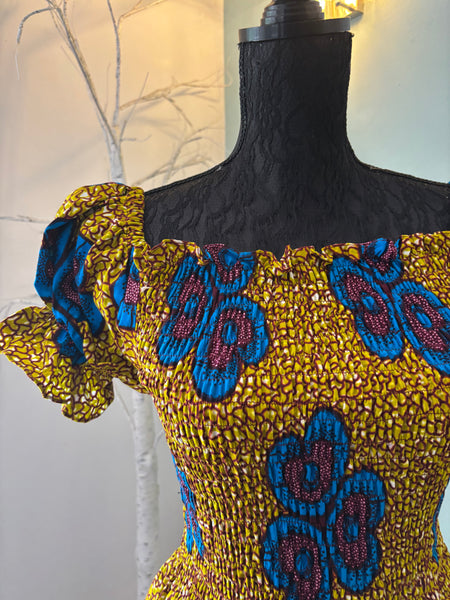 Tande peasant inspired smocked maxi dress.