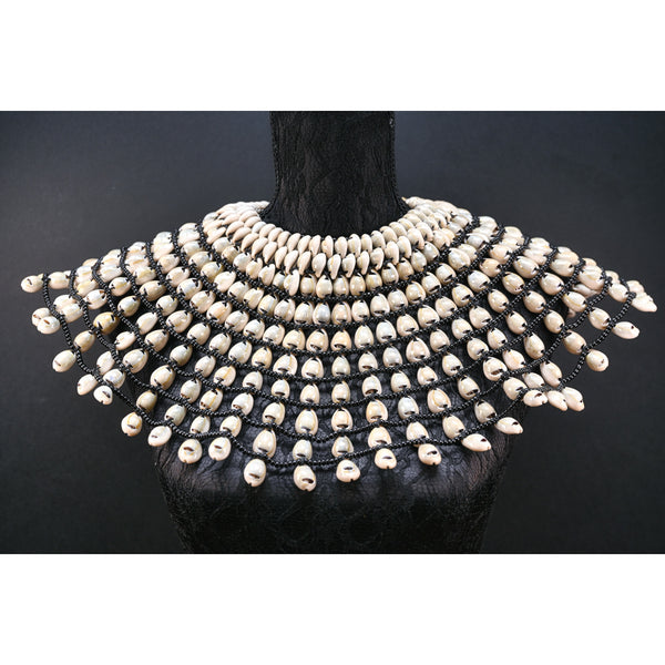 Statement Cowrie bib necklace.