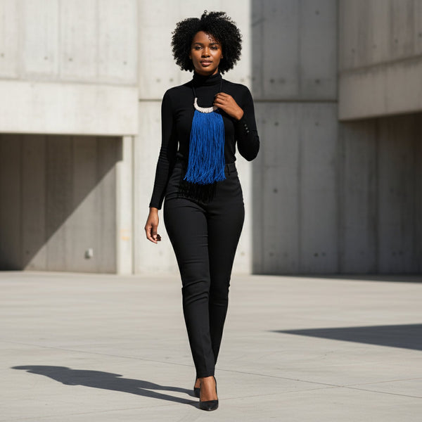 Blue statement long fringe necklace embellished with cowries.