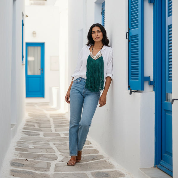 Green fringe necklace with cowrie beads.