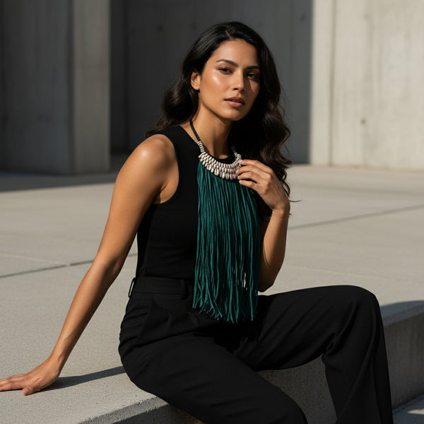 Green fringe necklace with cowrie beads.