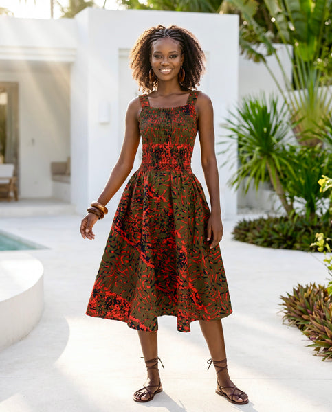 Yiko cut out dress in red and brown hues.