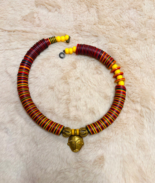 Yuya multicoloured bronze mask choker with dashes of yellow.