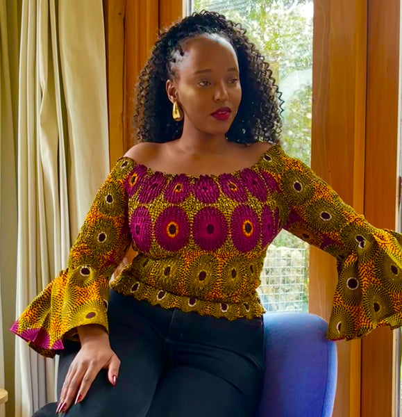 African print bell sleeves Smocked top in a vintage geometric print.