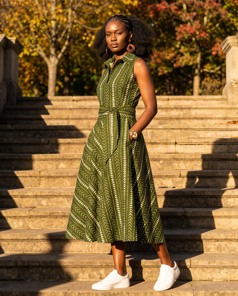 Shali sleeveless dress in a olive green geometric African print.