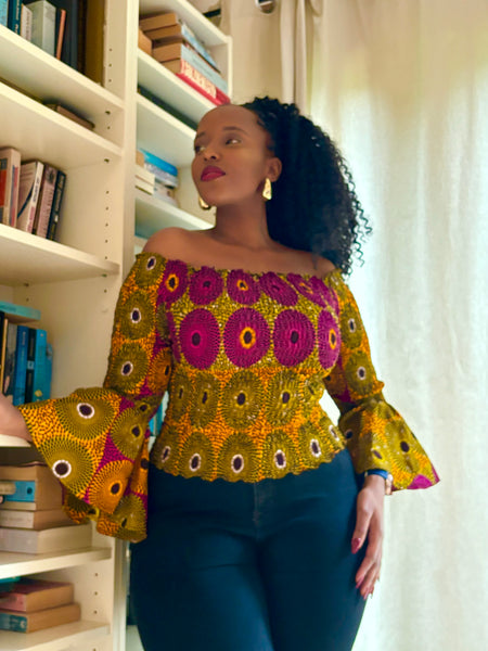 African print bell sleeves Smocked top in a vintage geometric print.