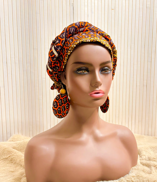 African print head wrap and large disc earrings set in an orange geometric vintage print.