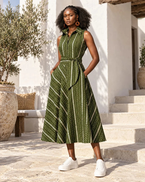 Shali sleeveless dress in a olive green geometric African print.