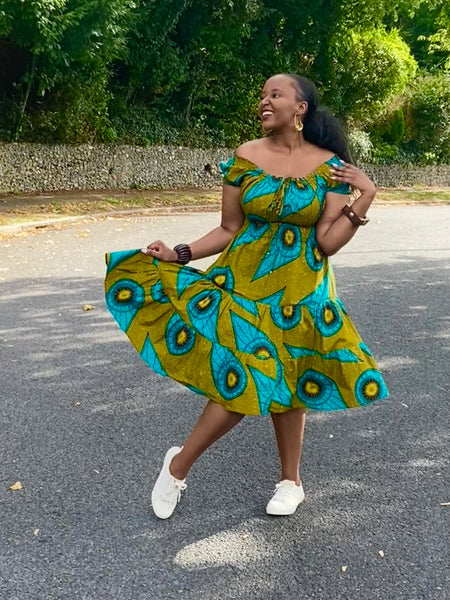 Smocked peasant inspired African print dress.