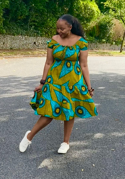 Smocked peasant inspired African print dress.