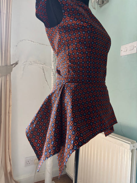 Zena Handkerchief hem peplum top in a vibrant contemporary geometric African print.