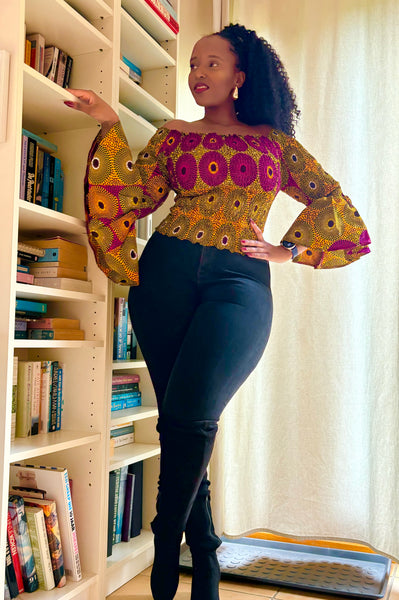 African print bell sleeves Smocked top in a vintage geometric print.