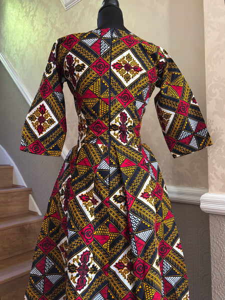 Rabi African print box pleat three quarter length sleeve dress.