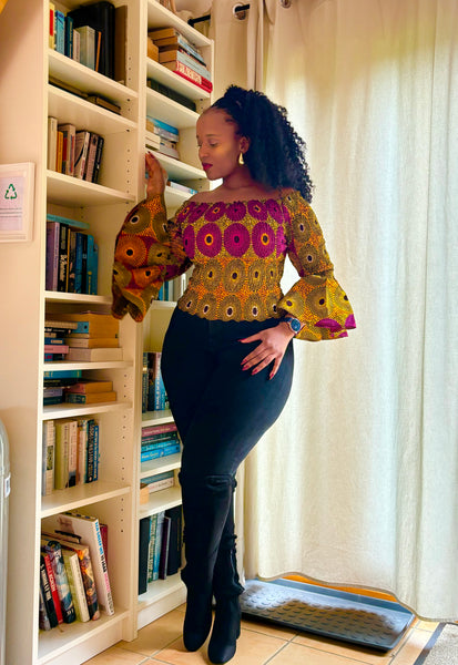 African print bell sleeves Smocked top in a vintage geometric print.