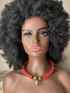 Yuya choker in coral with a bronze African mask pendant.