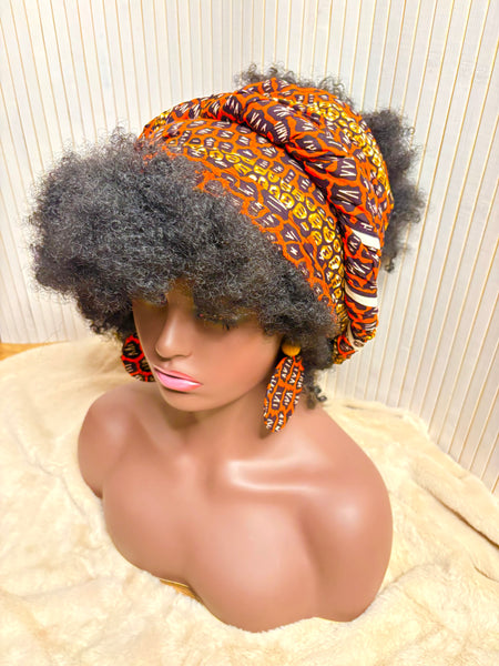 African print head wrap and large disc earrings set in an orange geometric vintage print.