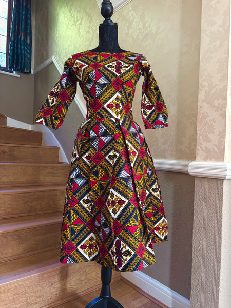 Rabi African print box pleat three quarter length sleeve dress.