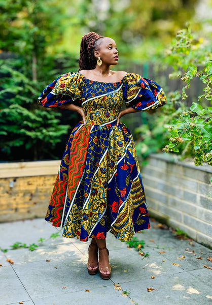 FAHRA swing dress in a mixed print in blue and orange hues with statement sleeves.