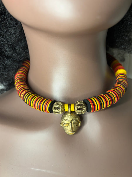 Yuya multicoloured bronze mask choker with dashes of yellow.