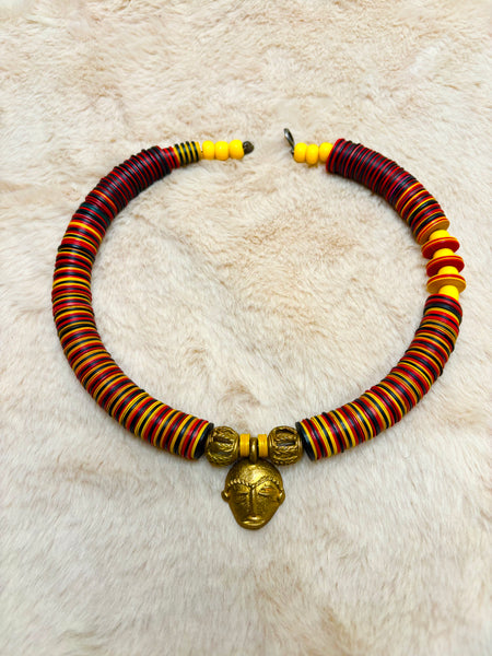 Yuya multicoloured bronze mask choker with dashes of yellow.