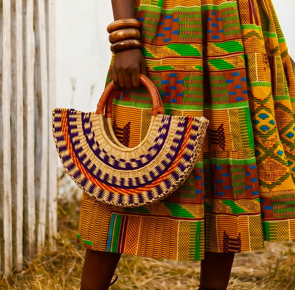 Hand woven sculptured straw half moon bag with leather handles