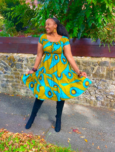 Smocked peasant inspired African print dress.