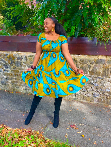 Smocked peasant inspired African print dress.