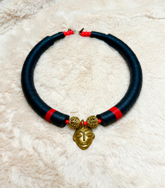 Yuya black choker with an African bronze mask pendant.