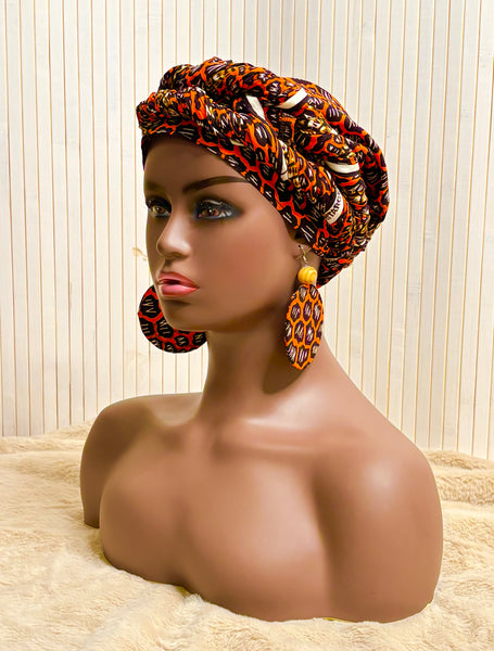 African print head wrap and large disc earrings set in an orange geometric vintage print.