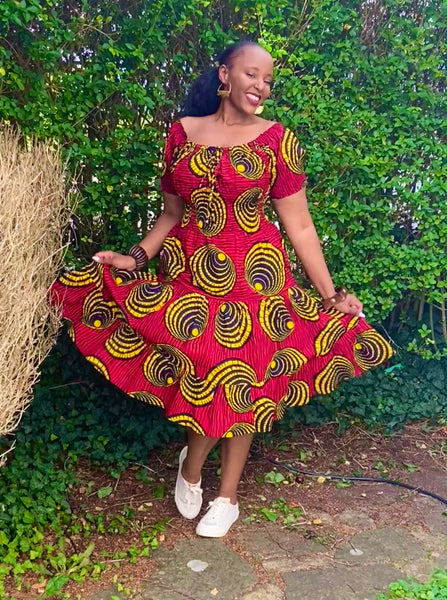 Smocked peasant inspired African print dress.