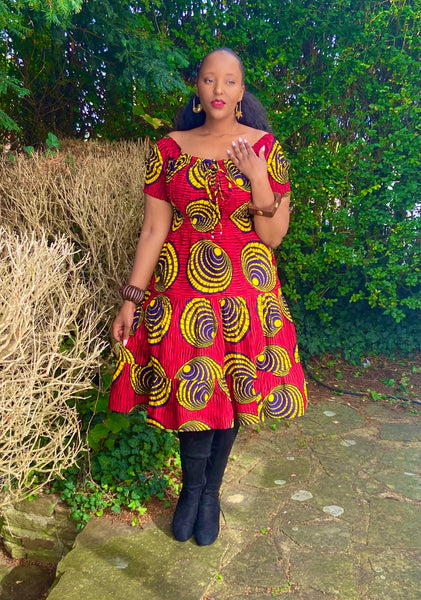 Smocked peasant inspired African print dress.