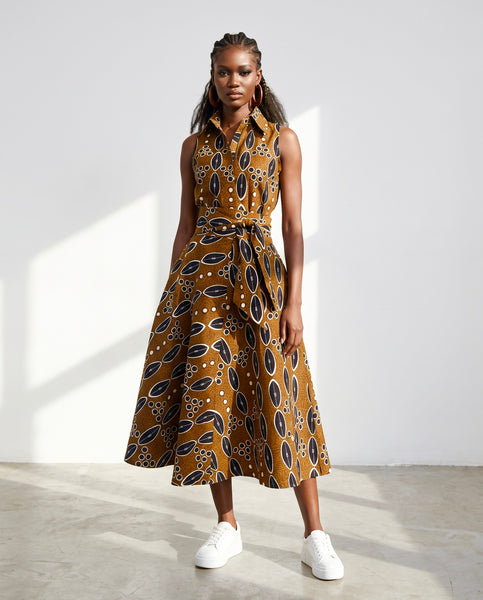 Shali sleeveless dress in a contemporary African print in brown.