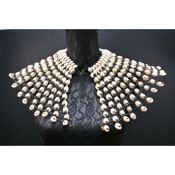 Statement Cowrie bib necklace.