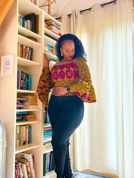 African print bell sleeves Smocked top in a vintage geometric print.