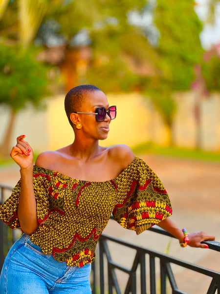 RAHE smocked puff sleeve blouse in brown.