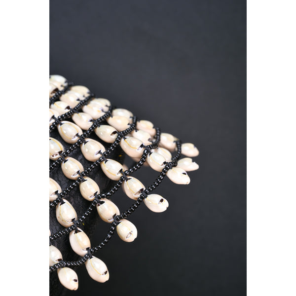 Statement Cowrie bib necklace.