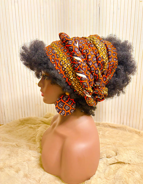 African print head wrap and large disc earrings set in an orange geometric vintage print.