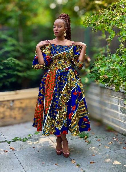 FAHRA swing dress in a mixed print in blue and orange hues with statement sleeves.