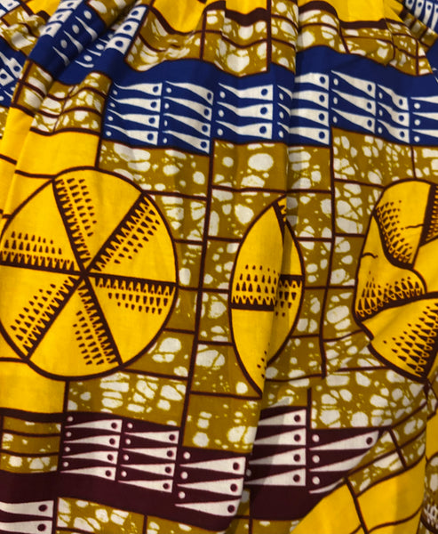 Lola African print smocked sleeveless maxi dress in a vibrant geometric print.