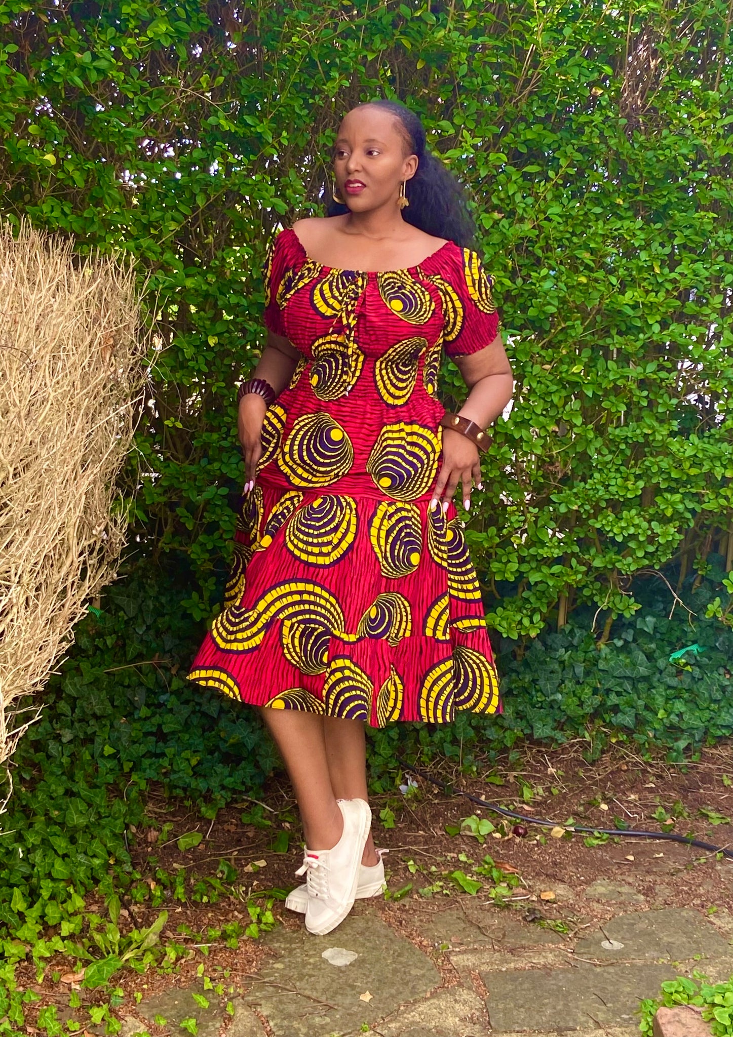 Smocked peasant inspired African print dress.