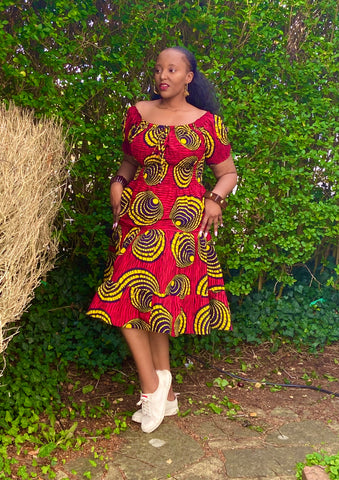 Smocked peasant inspired African print dress.