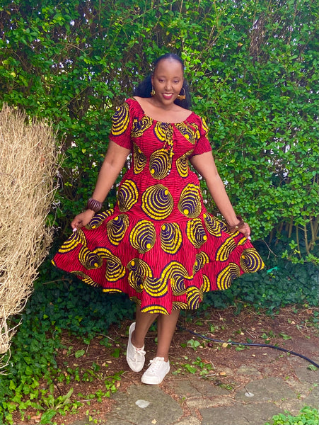 Smocked peasant inspired African print dress.